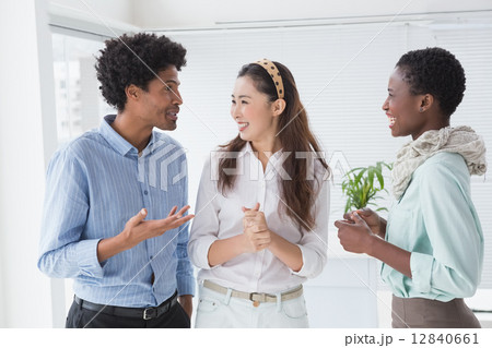 Creative team smiling and talking 12840661