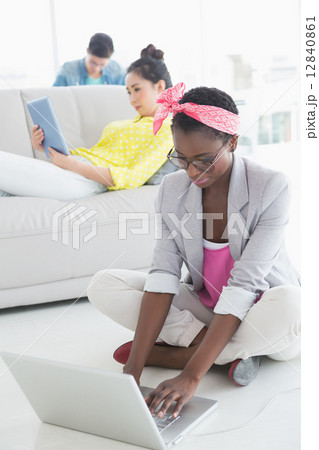 Young creative woman working on floor 12840861