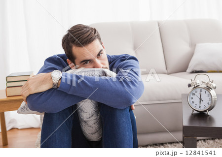 Depressed young man looking at camera 12841541
