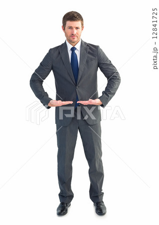 Businessman standing with hands out Businessman standing with hands out 12841725