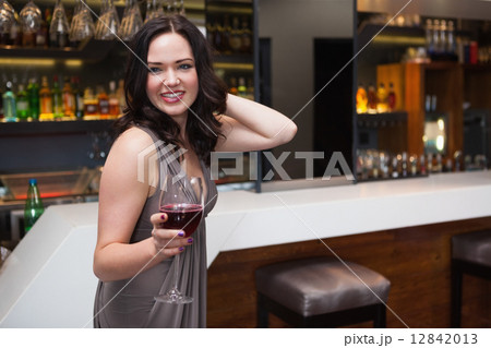 Pretty brunette enjoying red wine Pretty brunette enjoying red wine 12842013