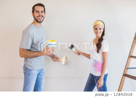 Cute couple painting the wall 12842016