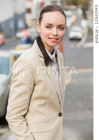 Young businesswoman smiling and walking 12842043