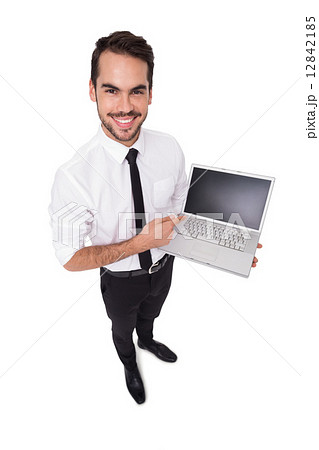 Smiling businessman pointing his laptop Smiling businessman pointing his laptop 12842185