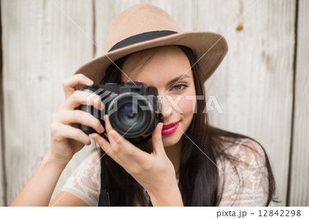 Pretty brunette taking a photo 12842298