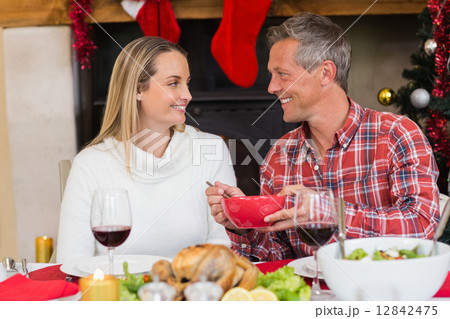 Man serving wife during the dinner 12842475