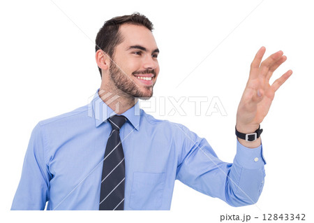 Happy businessman catching something with his hand 12843342