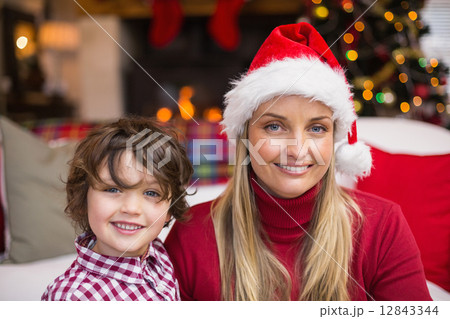 Festive mother and son smiling at camera 12843344
