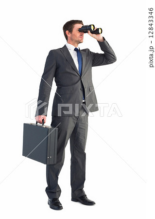 Businessman looking through binoculars 12843346