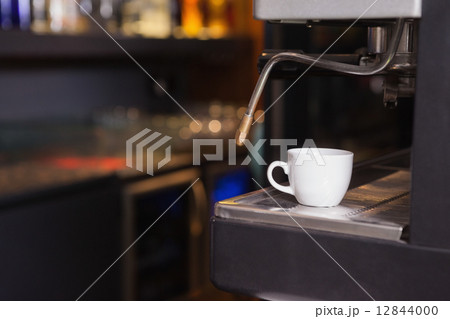 Cup of coffee on the espresso maker 12844000