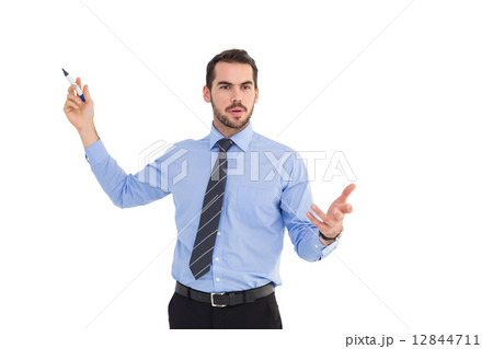 Businessman speaking and gesturing with marker Businessman speaking and gesturing with marker 12844711