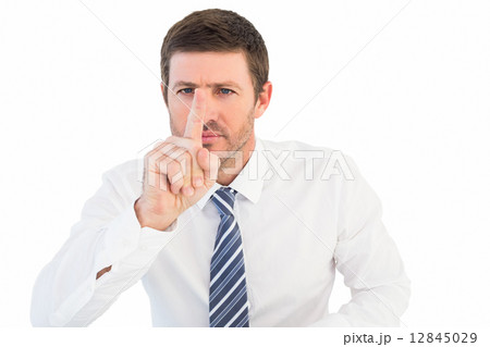 Businessman pointing with his finger 12845029
