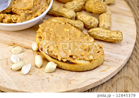 Sandwich with peanut butter and nuts on board 12845379