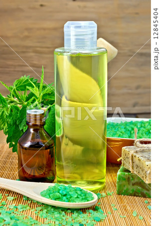 Shampoo and toiletries with nettles on board 12845404