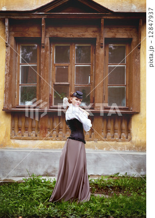 Beautiful redhair woman in vintage clothes 12847937