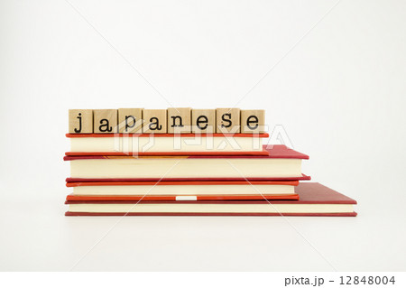 japanese language word on wood stamps and books 12848004
