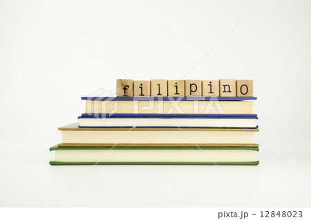 filipino language word on wood stamps and books 12848023