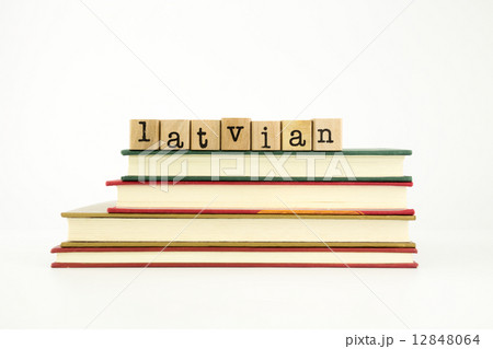 latvian language word on wood stamps and books 12848064