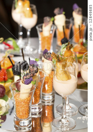 Canapes of cheese vegetables meat and seafood on white background Canapes of cheese vegetables meat and seafood on white background 12849885