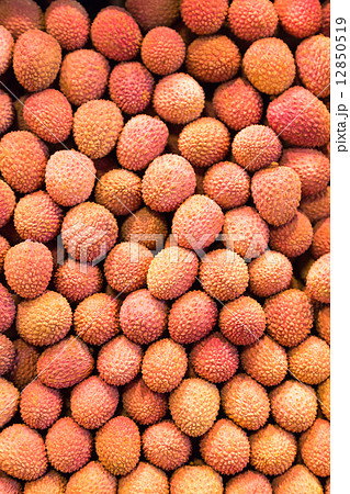 Many lychees at a market stall Many lychees at a market stall 12850519