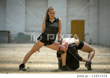 Beautiful couple of professional artists dancing 12851428