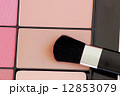 close up of a make up powder and brush 12853079