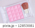 close up of a make up powder and brush 12853081