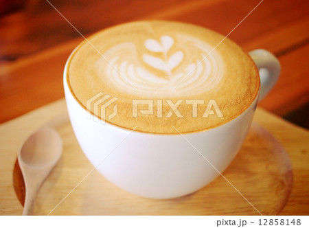 Cup of latte or cappuccino coffee with wooden spoon Cup of latte or cappuccino coffee with wooden spoon 12858148