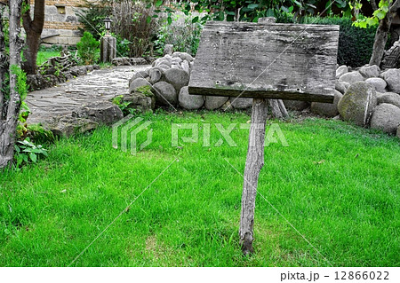 Weathered Signpost Board on the Grass Area Weathered Signpost Board on the Grass Area 12866022