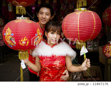 Lovely couple with red paper chinese lantern in Chinese suit 12867176
