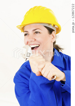 Woman holding Adjustable Wrench 12867222