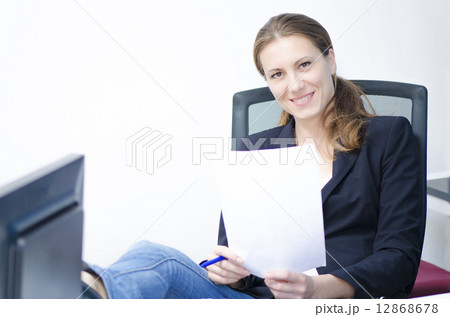 A relaxed business woman A relaxed business woman 12868678