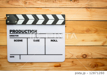 Movie slate film on wooden table 12871260