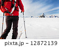 Mountaineer exploring a glacier with the skis during a high-alti Mountaineer exploring a glacier with the skis during a high-alti 12872139