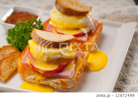 eggs benedict on bread with tomato and ham eggs benedict on bread with tomato and ham 12872499
