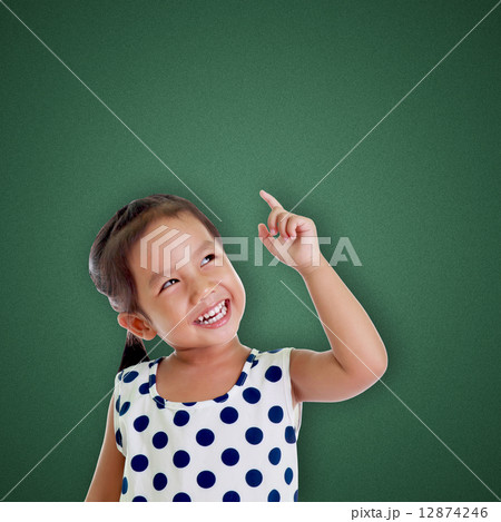 Portrait of cute girl point up 12874246