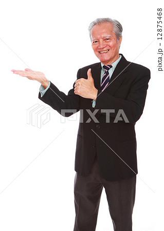 white background oldman studio shot businessman portrait suit senior formal smiling thumbsup welcome 12875468