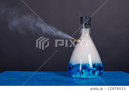 Blue bottle with dry ice soars. 12876013