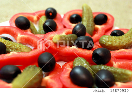 Black olives, marinaded cucumbers and paprika 12879939