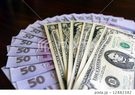 dollars and grivnas banknotes on the dark dollars and grivnas banknotes on the dark 12882382