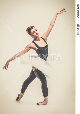 Young ballerina dancer in tutu showing her techniques 12888386