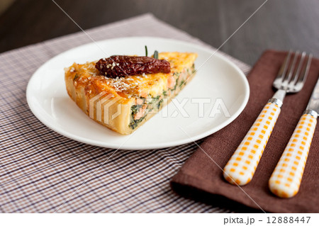 Piece of pie with spinach and fish salmon 12888447