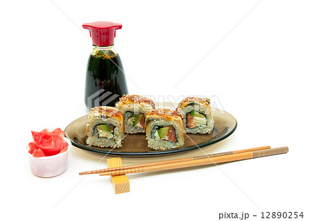 Roll with eel, salmon and avocado, ginger and soy sauce on white Roll with eel, salmon and avocado, ginger and soy sauce on white 12890254