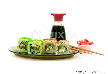 delicious rolls with eel, salmon and avocado on a plate on white 12890255