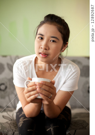Girl Drinking Tea or Coffee in Cafe Girl Drinking Tea or Coffee in Cafe 12892687