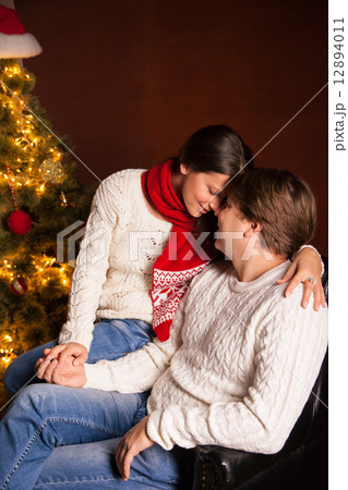 Happy Smiling Family at home celebrating New Year Happy Smiling Family at home celebrating New Year 12894011