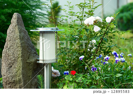 Solar Powered Lamp on Garden Background. 12895583