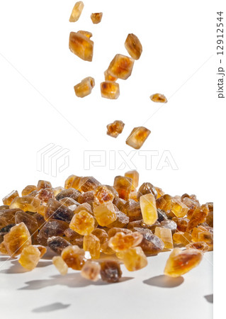 Slices of falling brown candy sugar 12912544