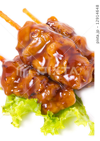 Chicken teriyaki with skewers isolated on white. 12914648