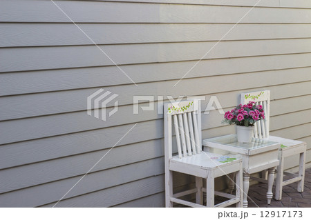 white chair and gray wall white chair and gray wall 12917173